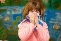 Little girl with runny nose wipes her nose Royalty Free Stock Photo