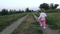 The little girl runs along the path Royalty Free Stock Photo