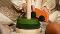 Little girl's hand playing with a a wooden rolling