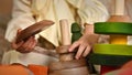 Little girl's hands playing with a wooden stacking