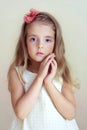 Little girl's portrait. Tender serious child, fashion model.