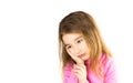 Little girl with sad face holds her cheek with hand - tooth hurts. Ear pain, toothache, swollen cheek and gums, problems of