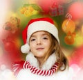 Little girl in santa clothes dreaming about christmas, new year. Royalty Free Stock Photo