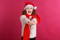 Little girl in santa hat is holding fake snow Royalty Free Stock Photo