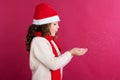 Little girl in santa hat is holding fake snow Royalty Free Stock Photo