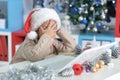 Little girl in Santa hat with laptop Royalty Free Stock Photo