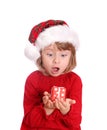 Little girl with santa hat and red gift box Royalty Free Stock Photo