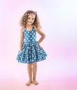 Little girl with sassy attitude in pretty dress