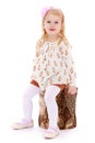 Little girl sat down on a stump Royalty Free Stock Photo