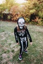 Little girl in a scary skeleton Halloween costume