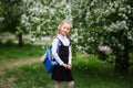 Little girl with a school backpack. The concept of school, study, education, friendship, childhood Royalty Free Stock Photo