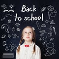 Little girl school girl in white blouse. Back to school Royalty Free Stock Photo