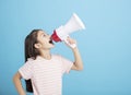 Little girl screaming and shouting with megaphone Royalty Free Stock Photo