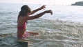 Little girl on the sea. Girl teenager bathing in sea happy water childhood and dreams