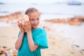 Little girl with a seashell