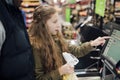 Little Girl at Self Service Checkout Royalty Free Stock Photo