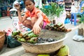 A little girl selling grilled honey