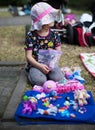 Little Girl Selling Her Old Toys