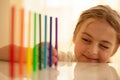 Little girl sets colorful felt pens in a row Royalty Free Stock Photo