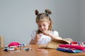 little girl sewing things by herself Royalty Free Stock Photo