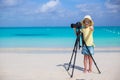 Little girl shooting with camera on tripod during Royalty Free Stock Photo