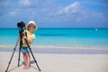 Little girl shooting with camera on tripod during Royalty Free Stock Photo