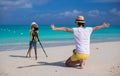 Little girl shooting with camera on tripod Royalty Free Stock Photo