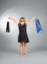 Little girl with shopping bags