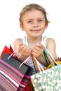 Little girl with shopping bags on white background Royalty Free Stock Photo