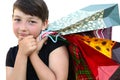 Little girl with shopping bags on white background Royalty Free Stock Photo