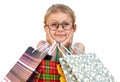 Little girl with shopping bags on white background Royalty Free Stock Photo