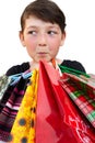 Little girl with shopping bags on white background Royalty Free Stock Photo