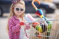 Little girl with shopping cart with products Royalty Free Stock Photo