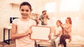 Little Girl Showing Blank Board near Cute Family