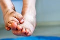 Little girl showing her dirty feet Royalty Free Stock Photo