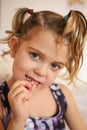 Little girl with loose tooth.