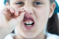 little girl showing her healthy teeth at dental office, smiling and waiting for a checkup. Early prevention Royalty Free Stock Photo