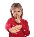 Little girl showing HUSH gesture in sign language on white Royalty Free Stock Photo