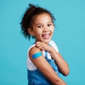 Im a big girl now. a little girl showing off a bandaid on her arm. Royalty Free Stock Photo