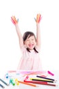 Little girl showing painted hand over white backgrou