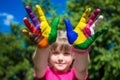 Little girl showing painted hands, focus on hands. Hand prints Royalty Free Stock Photo