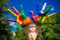 Little girl showing painted hands, focus on hands. Hand prints Royalty Free Stock Photo