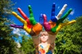 Little girl showing painted hands, focus on hands. Hand prints Royalty Free Stock Photo