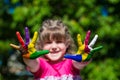 Little girl showing painted hands, focus on hands. Hand prints Royalty Free Stock Photo