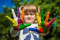Little girl showing painted hands, focus on hands. Hand prints Royalty Free Stock Photo