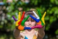 Little girl showing painted hands, focus on hands. Hand prints Royalty Free Stock Photo