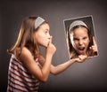 Little girl showing silence gesture