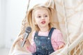 A little girl is singing karaoke into the microphone. The concept of childhood, performer, life style, music.