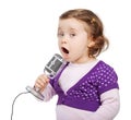 Little girl sings into the microphone. Royalty Free Stock Photo