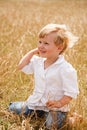 Little girl sit on her knees Royalty Free Stock Photo